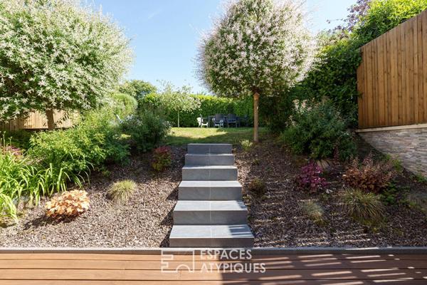 Maison rénovée et son jardin paysager
