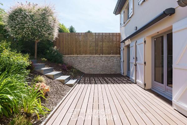 Maison rénovée et son jardin paysager