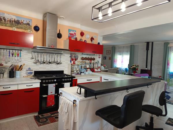 MAISON DE PLAIN-PIED AVEC GARAGE A DEUX PAS DES COMMODITES