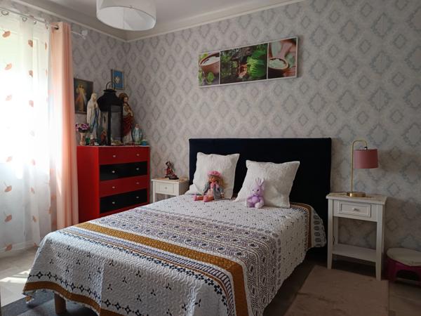 MAISON DE PLAIN-PIED AVEC GARAGE A DEUX PAS DES COMMODITES