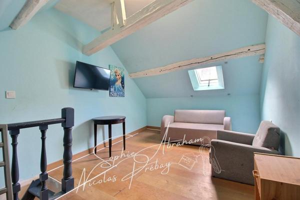 Maison en centre ville avec jardin, terrasse et places de parkings privatives