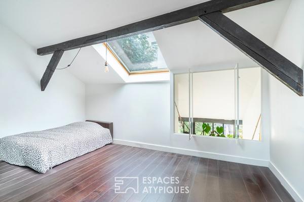 Loft traversant avec verrière et terrasse