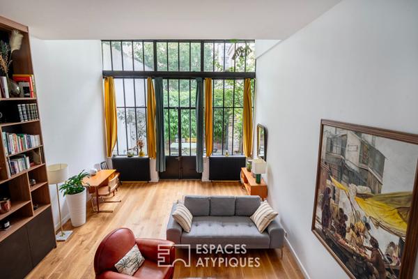 Loft traversant avec verrière et terrasse