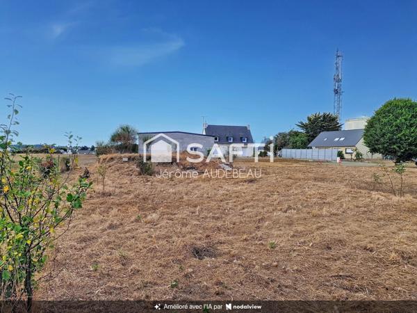 Beau terrain à bâtir avec grand garage déjà édifié