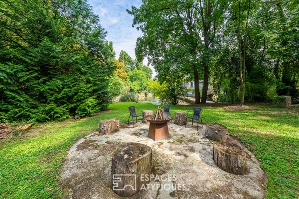 Appartement au coeur d’un ancien moulin rénové et dans un parc arboré.