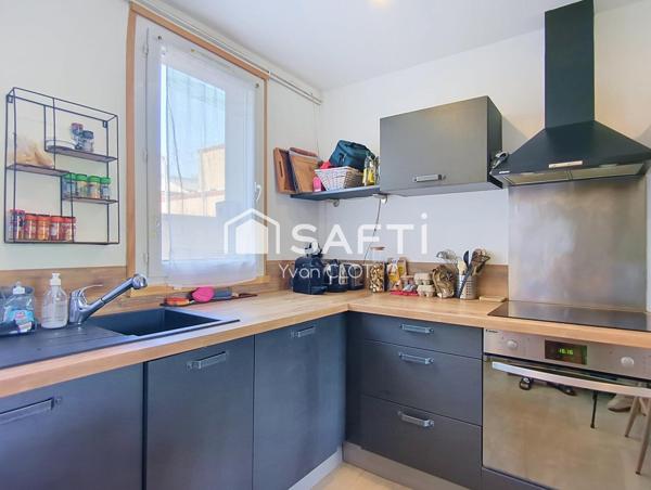 Appartement 3 pièces 49m² + place de parking et 2 caves