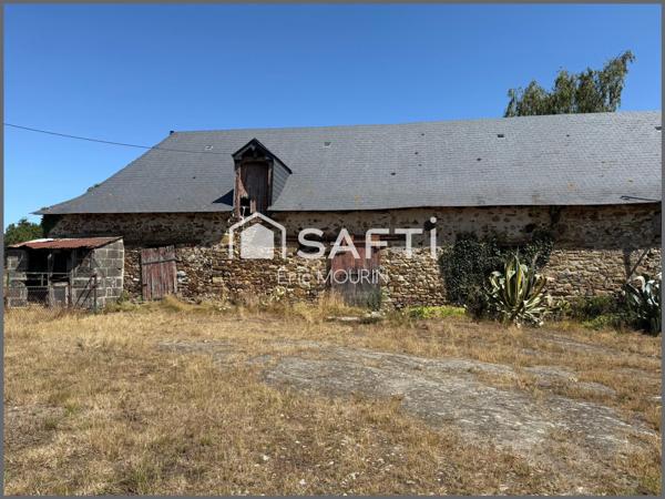 Cette spacieuse maison avec une longère à restaurer.
