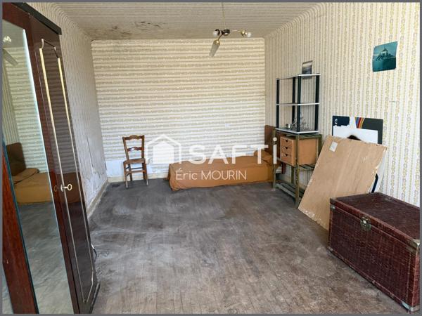 Cette spacieuse maison avec une longère à restaurer.