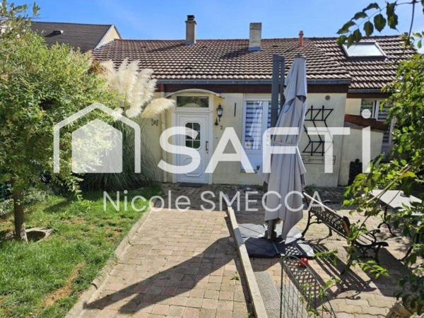 Maison mitoyenne,garage,jardin,terrasse,véranda