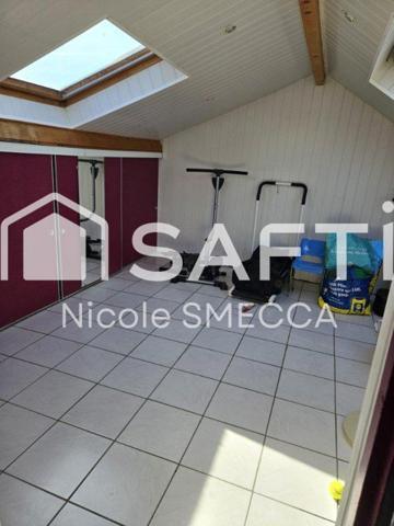 Maison mitoyenne,garage,jardin,terrasse,véranda