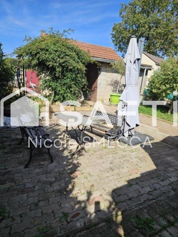 Maison mitoyenne,garage,jardin,terrasse,véranda