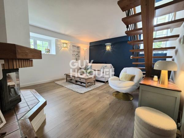 Maison à vendre de 6 pièces de 125 m² habitables (200 m2 avec garages et cave) sur un terrain de 1185 m2