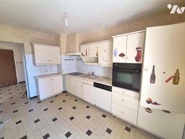 Appartement T4 77 m² -RDC sur élevé- Cave- Garage 