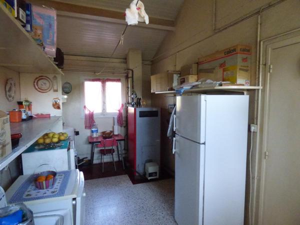 Maison plain pied de 100 m², 2 chambres, garage, terrain de 1450 m²