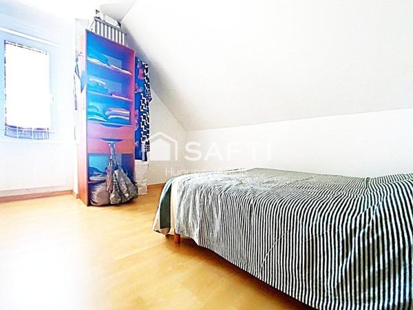 Proche toutes commodités maison avec 4 chambres, véranda et sous-sol