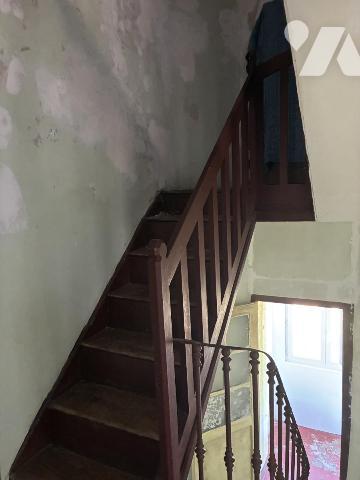 Une maison à usage d'habitation mitoyenne par deux faces