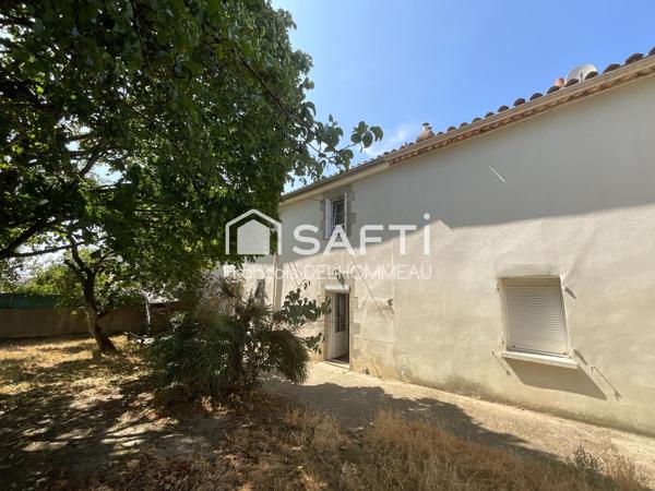 Maison mitoyenne 91m2, 2 chambres, bureau 18m2 et terrain clôturé