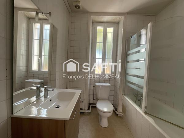 Maison mitoyenne 91m2, 2 chambres, bureau 18m2 et terrain clôturé