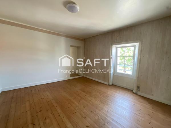 Maison mitoyenne 91m2, 2 chambres, bureau 18m2 et terrain clôturé
