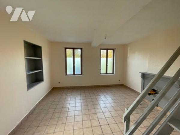 UNE MAISON A USAGE D'HABITATION