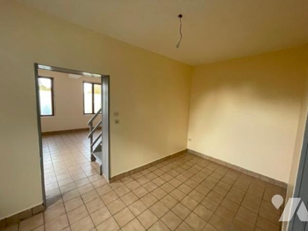 UNE MAISON A USAGE D'HABITATION