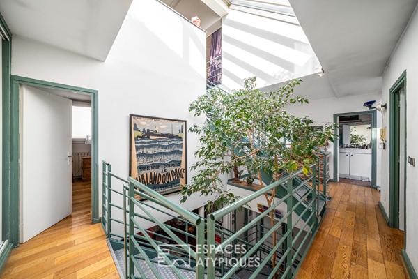 Maison au style industriel avec terrasse sur le toit à Maison Blanche