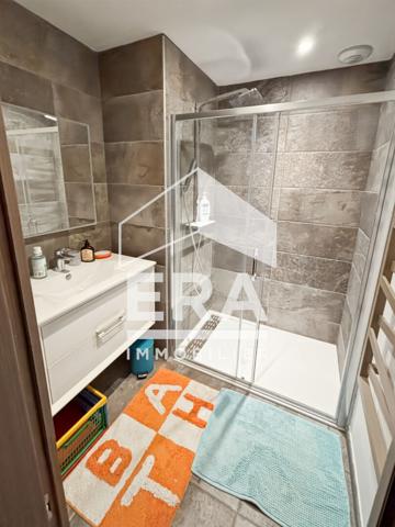 Appartement unique avec ascenseur terrasse et 2 places parking
