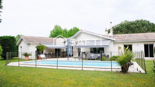 Superbe maison plain-pied baignée de lumière avec double garage et piscine