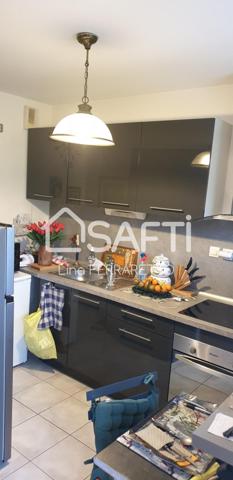 appartement 3 piéces 2 chambres + place de parking.