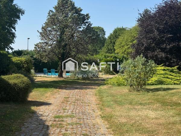 Charmante maison avec garage, carport et piscine