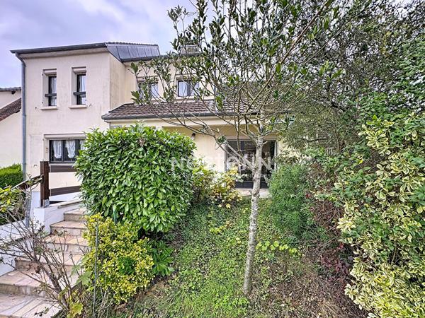 Maison spacieuse à vendre à Domont - 4 chambres, jardin et garage