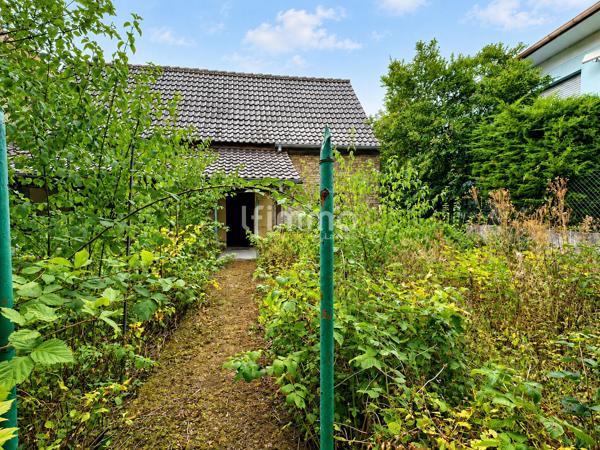 Belle opportunité : maison avec grange, jardin , garage et dépendance