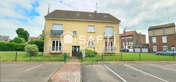 Immeuble en monopropriété offrant un bon rapport : avec 5 lots, garages, caves, jardin, stationnement ext, poche gare et commodités.