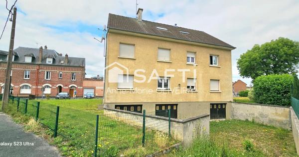 Immeuble en monopropriété offrant un bon rapport : avec 5 lots, garages, caves, jardin, stationnement ext, poche gare et commodités.