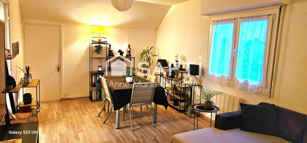 Immeuble en monopropriété offrant un bon rapport : avec 5 lots, garages, caves, jardin, stationnement ext, poche gare et commodités.