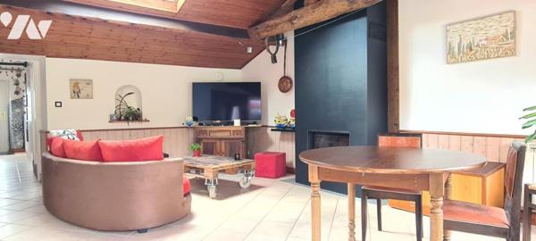 Maison de plain-pied de 60,80 m² et ses dépendances sur un terrain clos d'environ 515 m² 