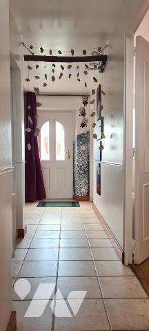 Maison de plain-pied de 60,80 m² et ses dépendances sur un terrain clos d'environ 515 m² 