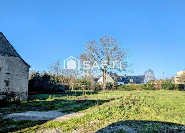 Terrain au calme et à distance à pied des commodités