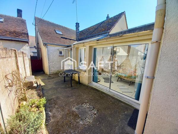 Maison atypique avec jardin, idéale pour une famille.