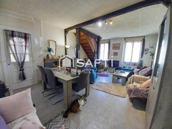 Maison atypique avec jardin, idéale pour une famille.