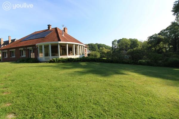 Propriété sur un terrain de 12888 m² comprenant 2 habitations (185m² et 75 m²)