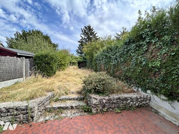 Maison familiale avec jardin – 4 chambres – Beau potentiel