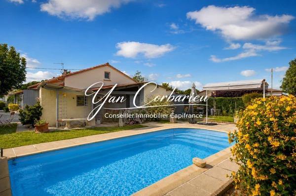 Maison familiale de plain-pied avec véranda, garage et piscine