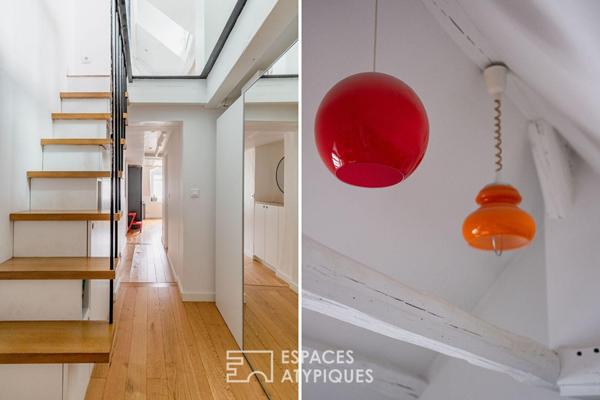 Dernier étage lumineux avec vue sur les toits de Paris