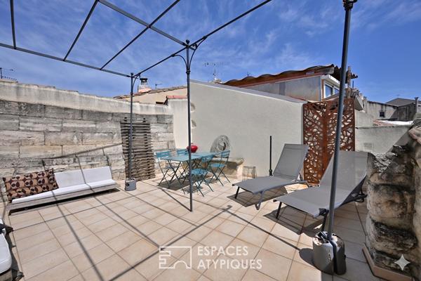 Appartement de type loft avec terrasse sur les toits
