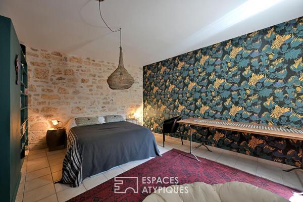 Appartement de type loft avec terrasse sur les toits