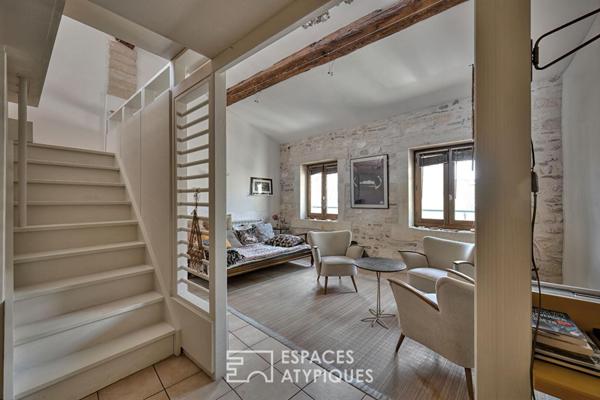 Appartement de type loft avec terrasse sur les toits