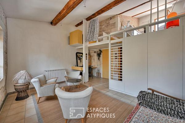 Appartement de type loft avec terrasse sur les toits