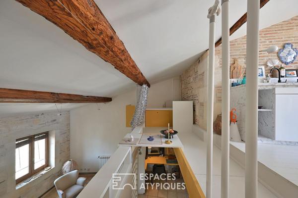 Appartement de type loft avec terrasse sur les toits