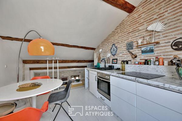 Appartement de type loft avec terrasse sur les toits
